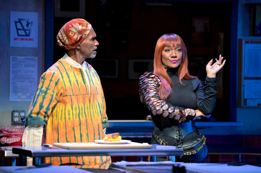 Harold Surratt as Montrellous tries to convince April Nixon's Clyde to set the diner's sights higher in "Clyde's" at the Huntington Theatre Company mainstage. (Courtesy Kevin Berne)