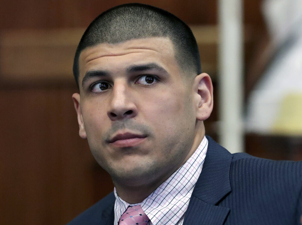 In this 2016 file photo, former New England Patriots NFL football player Aaron Hernandez listens during a court hearing before his double murder trial in Boston. Hernandez was acquitted in the criminal murder trial in 2017, but hanged himself in prison just days later. (John Blanding/The Boston Globe via AP, Pool)