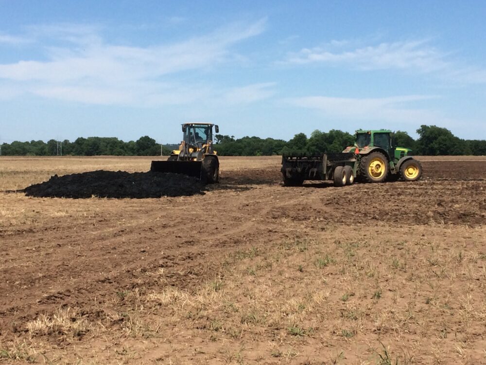 Fertilizer containing sludge being applied to farmland. (Courtesy North East Biosolids and Residuals Association)